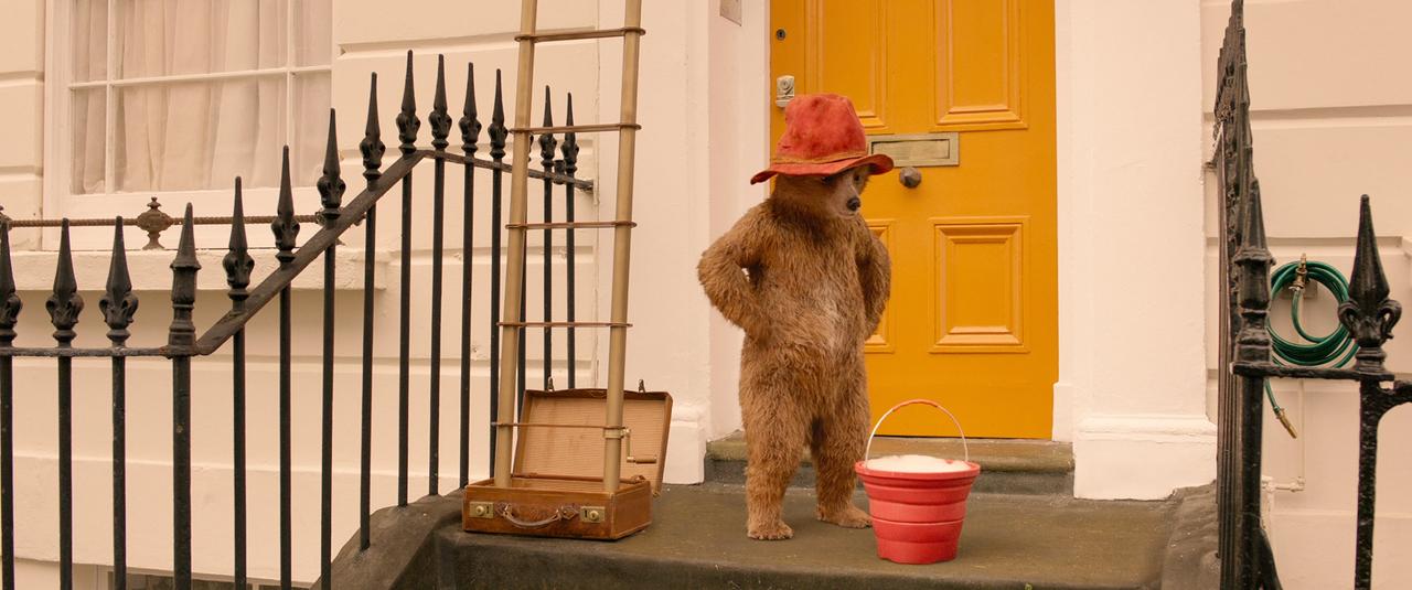 Movie still from Paddington 2 featuring Paddington Bear