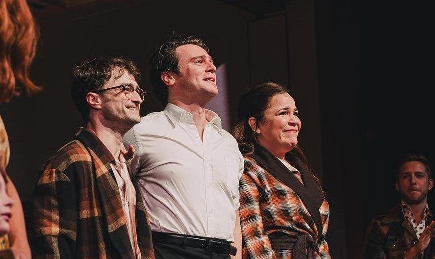 Photo of Daniel Radcliffe, Jonathan Groff, and Lindsay Mendez at curtain call