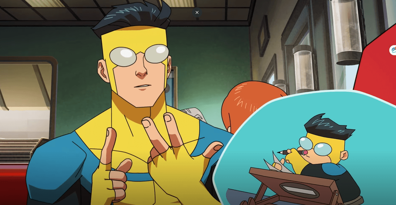 Character in a blue and yellow superhero suit sitting in a diner with a small chibi version drawing at a table