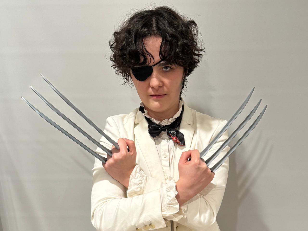 An image of Jules Chin Greene cosplaying as Wolverine (Patch)