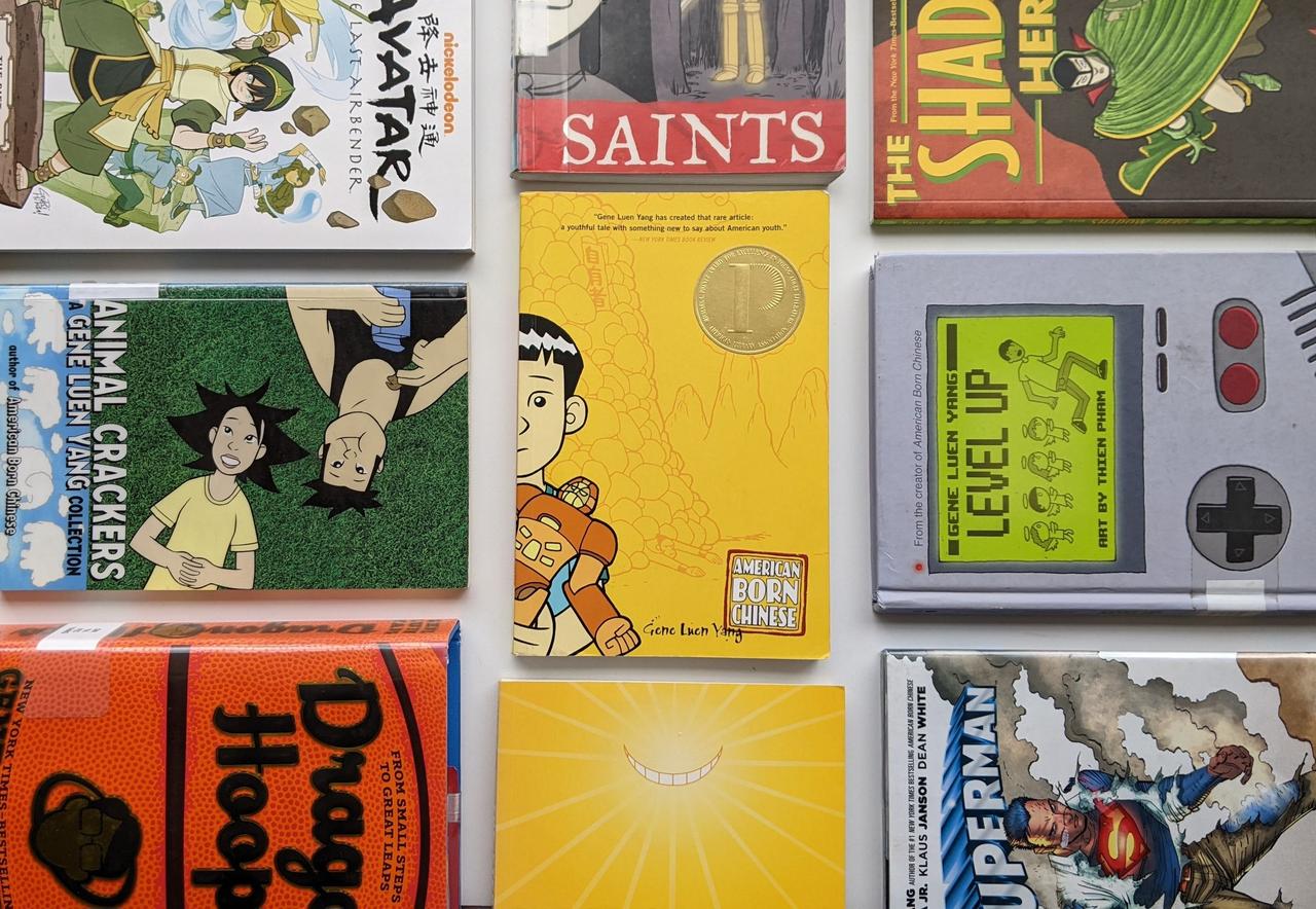 Photograph of nine Gene Luen Yang written and drawn comics and graphic novels