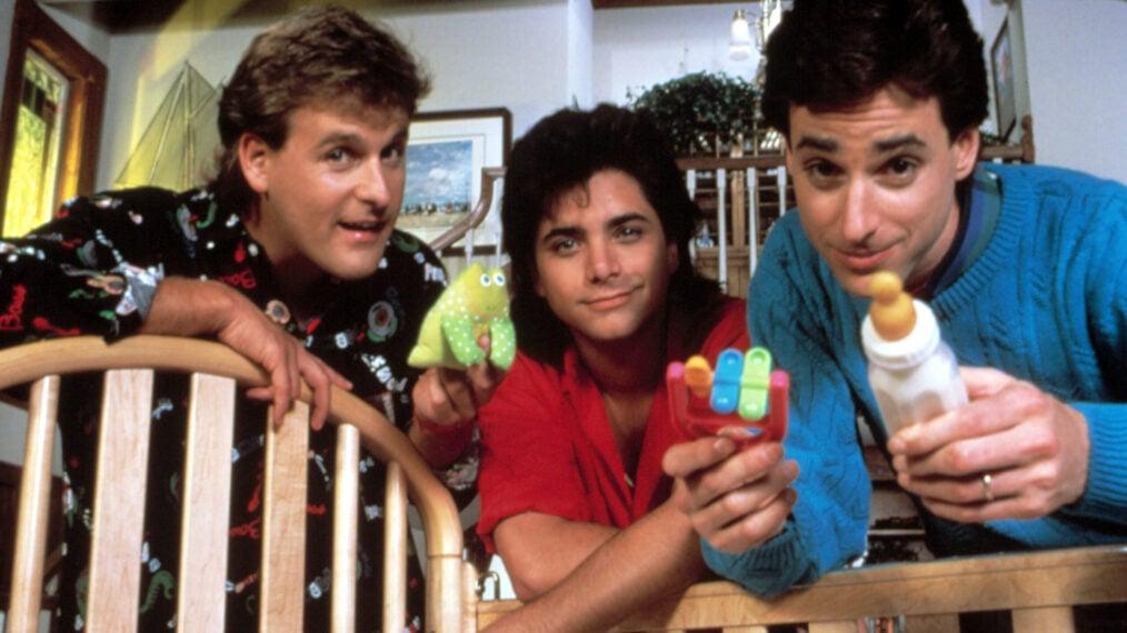 A promotional image of Dave Coulier, John Stamos, and Bob Saget for Full House