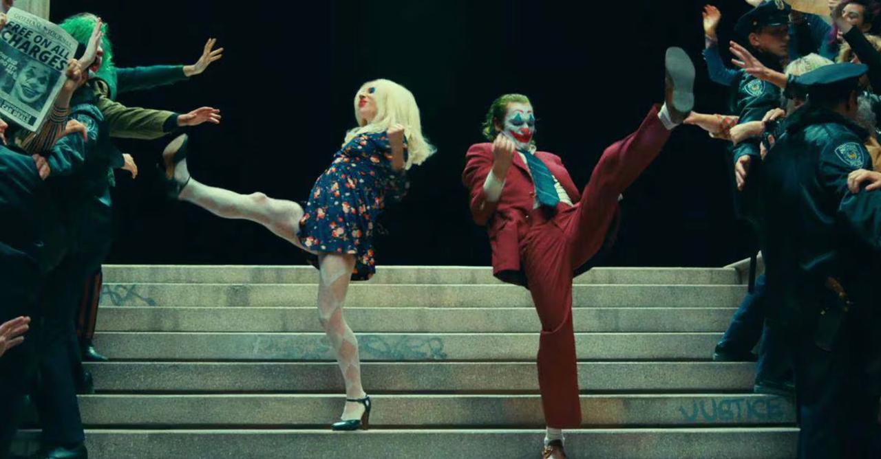 A still of Lady Gaga as Harleen Quinzel and Joaquin Phoenix as Joker in Joker: Folie à Deux
