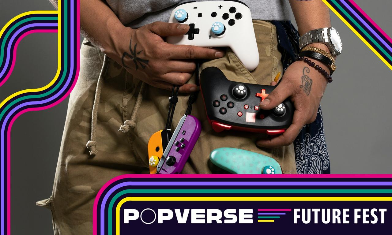 a man is holding a video game controller